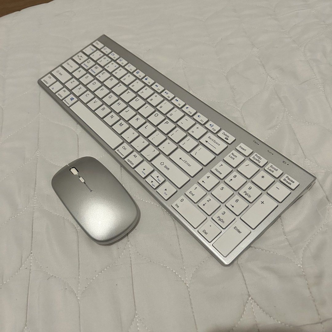Silver Wireless Keyboard and Mouse Combo (Category: Computer Keyboard) located in Dasmarinas. Submitted by brandedstuff.est2022 (Listing ID 1459790416, Image 1). Description: - Silver wireless keyboard and mouse set - Slim and modern design - Great for your desk setup - Works well and ready for a new home.