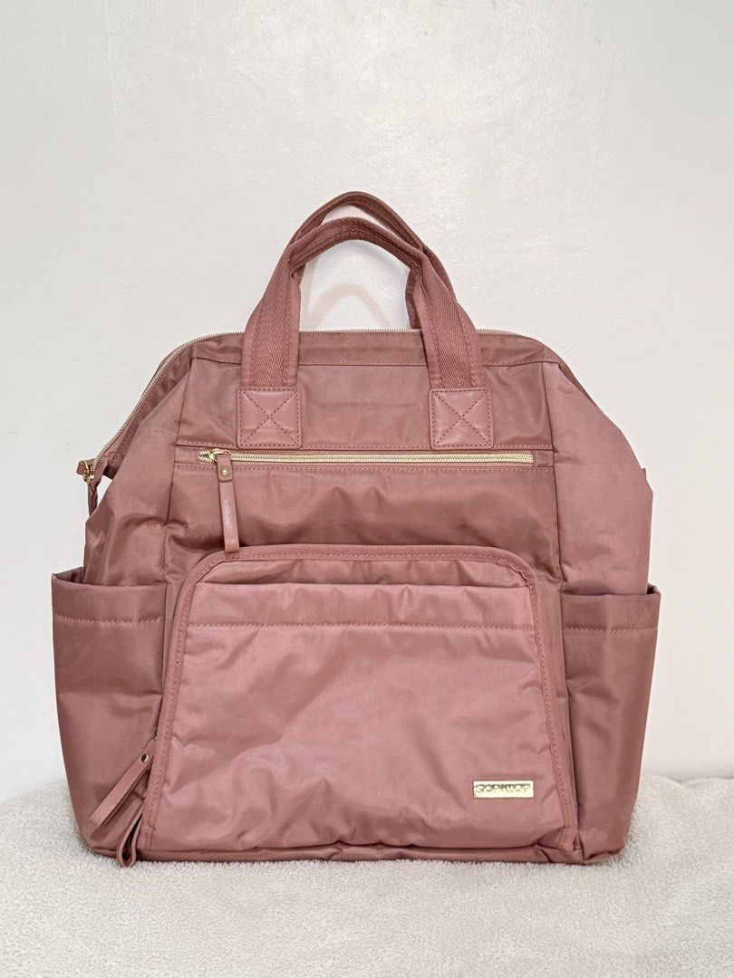 Skip Hop Diaper Backpack Rose Pink (Category: Backpacks) located in Manila. Submitted by swiftmoon_2cf635 (Listing ID 1459758753, Image 1). Description: - Chic rose pink diaper backpack - Two side pockets for easy access - Organized main compartment with internal pockets - Adjustable straps for a comfortable fit Needs washing.