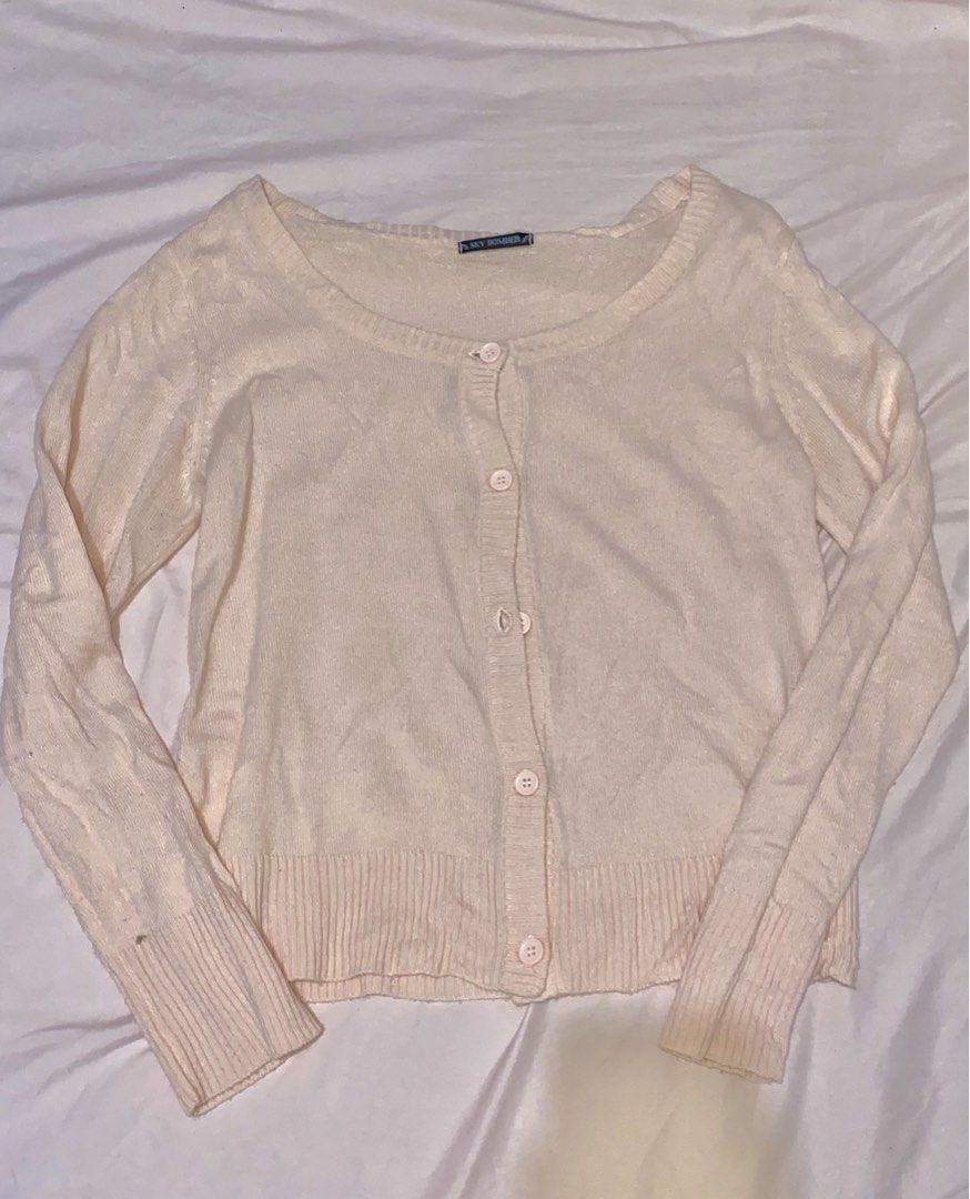 Sky Bomber Cream Button Up Cardigan (Category: Coats, Jackets and Outerwear) located in Burgos, Ilocos Sur. Submitted by imtsuyuri (Listing ID 1459835840, Image 1). Description: - Peach-baby pink cardigan from Sky Bomber - Button-up front closure - Ribbed hem and cuffs for a snug fit - Made from a soft knit material - Classic and simple design, perfect for layering.