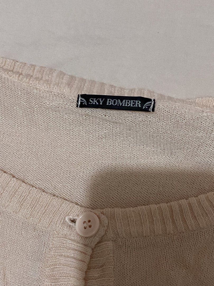 Sky Bomber Cream Button Up Cardigan (Category: Coats, Jackets and Outerwear) located in Burgos, Ilocos Sur. Submitted by imtsuyuri (Listing ID 1459835840, Image 2). Description: - Peach-baby pink cardigan from Sky Bomber - Button-up front closure - Ribbed hem and cuffs for a snug fit - Made from a soft knit material - Classic and simple design, perfect for layering.