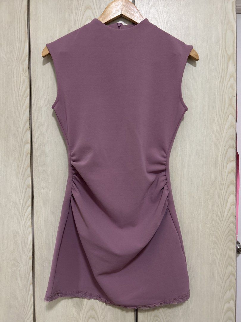 Sleeveless Mock Neck Ruched Dress (Category: Dresses) located in Makati City. Submitted by leannd (Listing ID 1459779376, Image 1). Description: - Sleeveless dress - Mock neck - Side ruching for a flattering fit - Subtle lace trim on the hem - Back zipper closure - Versatile for night outs or casual events.