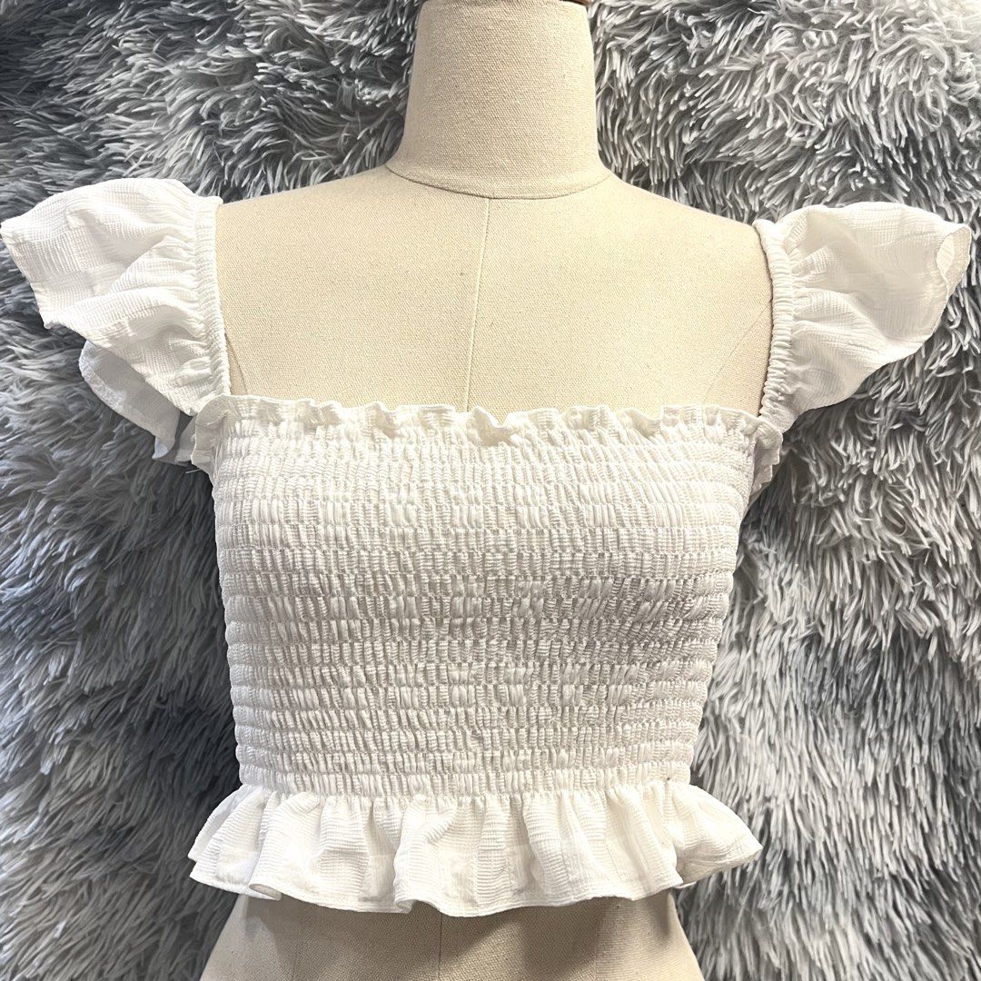 Smocked Square Neck Crop Top with Ruffle Sleeves (Category: Blouses) located in Manila. Submitted by trish.b (Listing ID 1459689326, Image 1). Description: Size: XS-Medium Available in White and Hot Pink Brandnew | ₱100 each.