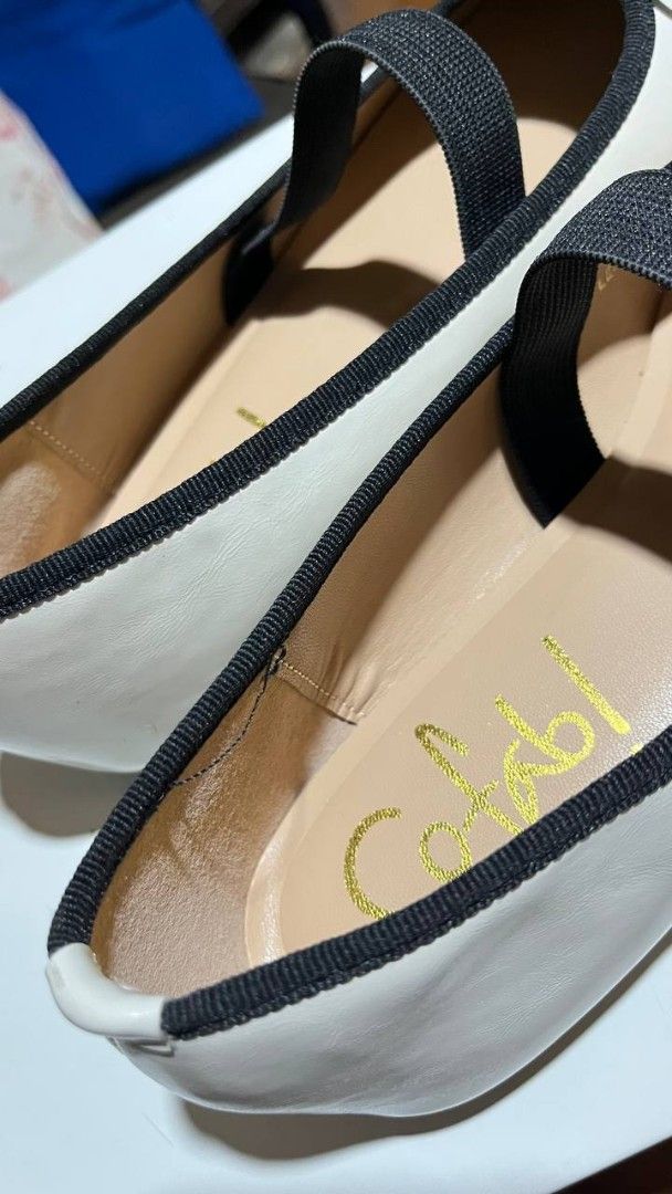 Sofab cream color flats shoes (Category: Flats & Sandals) located in Caloocan City. Submitted by twicefan2012579 (Listing ID 1459746113, Image 3). Description: -Brand: Sofab - Color: Cream with black trim and bow - Style: Ballet flats - Features: Elastic strap for secure fit, gold 'sofab' print on insole - Condition: Never used, only tried on - Flaws: Very small stain on the left shoe - Note: Price tag removed del fee will be shouldered by buyer 