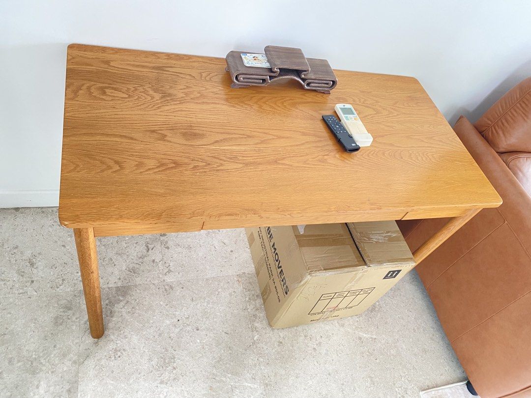 Solid wood dining table (Category: Tables & Sets) located in Singapore. Submitted by quickfox.6226cf (Listing ID 1459803323, Image 1). Description: - 1.2M (L)* 0.6M (W)*0.75 M( H) Simple wooden desk - Natural wood grain finish - One storage drawer - Perfect for study or living work area - Generous tabletop space -Self-collection around Marine Parade .