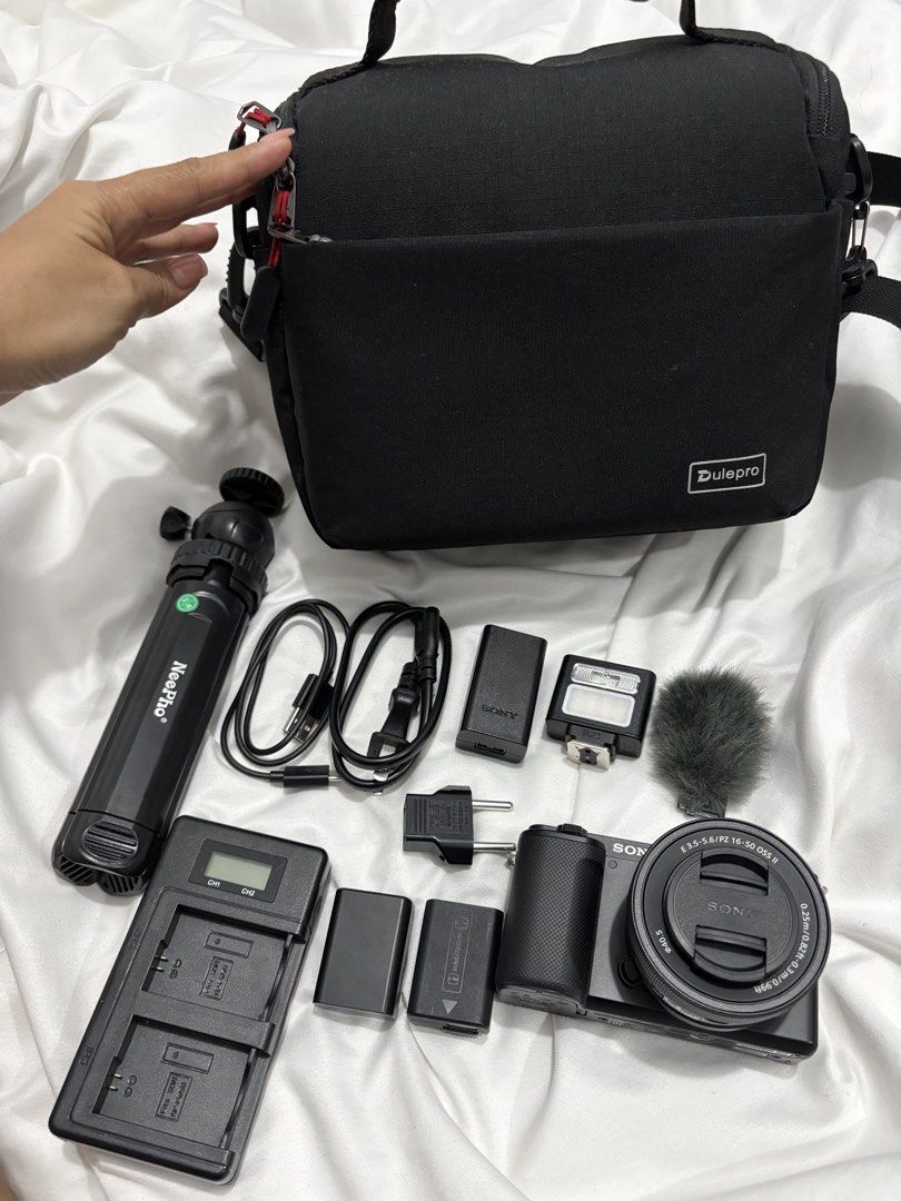 Sony Alpha ZV-E10 Mirrorless Camera with Kit Lens & Accessories (Category: Cameras) located in Bustos. Submitted by bigbite08 (Listing ID 1459879046, Image 1). Description: - Sony Alpha ZV-E10 Camera - E PZ 16-50mm OSS Lens - 2x Batteries - Charger - Small Tripod Grip - Hot Shoe Flash - Mini Microphone with Windscreen - Camera Bag - Original Box - Ideal for Vlogging & Photography.