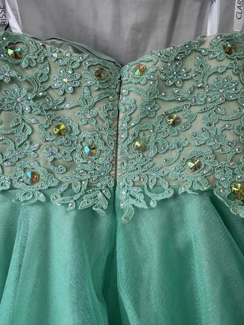 Sparkly Mint Green Strapless Party Dress (Category: Dresses) located in General Trias. Submitted by yuhgieros (Listing ID 1459739917, Image 2). Description: - Stunning mint green strapless dress - Intricate beadwork and sequins on the bodice - Layered tulle skirt with ruffled edges - Zipper closure at the back - Perfect for parties and special occasions.