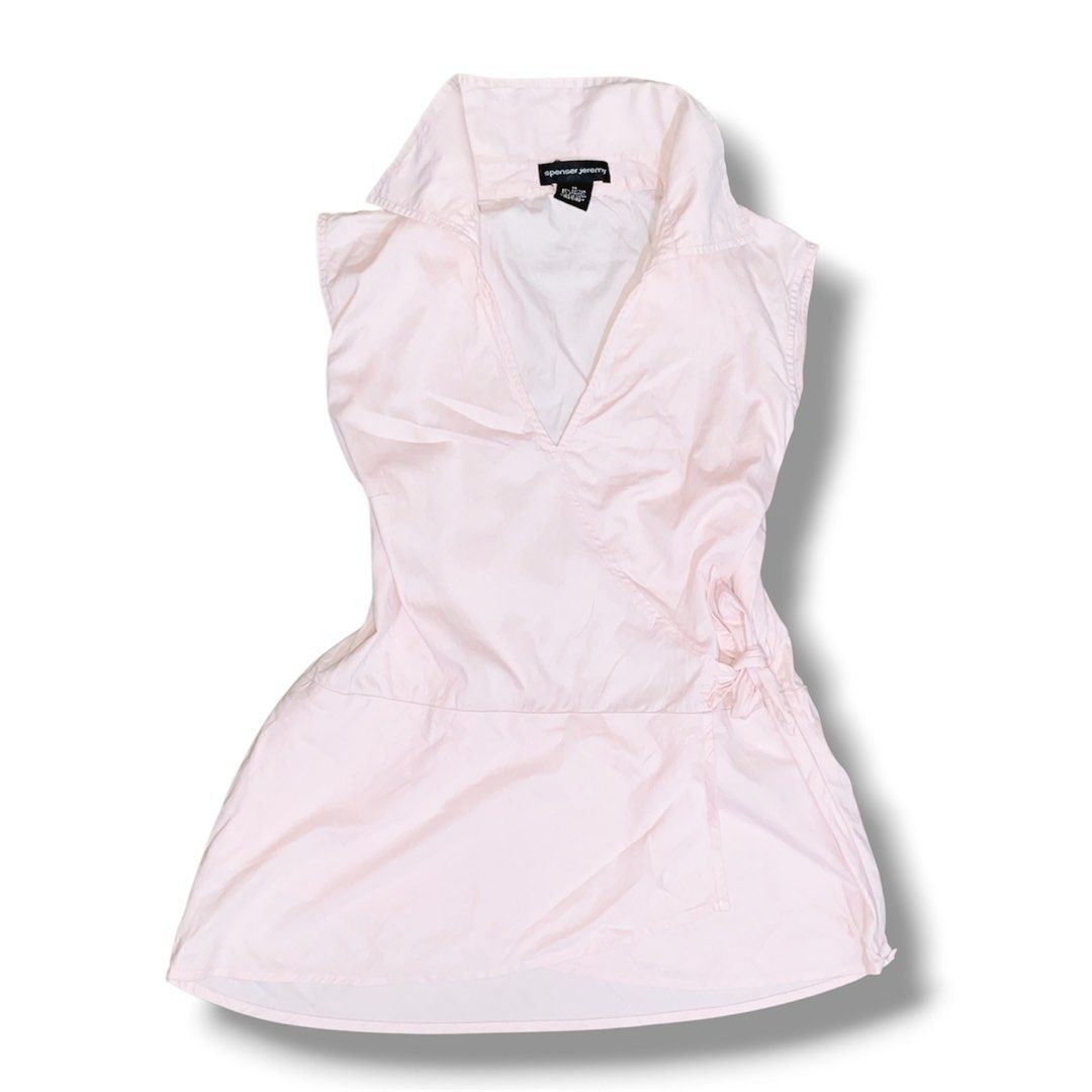 Spenser Jeremy Light Pink Sleeveless Top | Collared (Category: Clothes Drying Rack) located in Manila. Submitted by ssajii. (Listing ID 1459689485, Image 1). Description: ♡ Brand: Spenser Jeremy ♡ Color: Light pink ♡ Size: Medium to Semi-Large ♡ Style: Sleeveless collared top ♡ Features a wrap-style front with a cute side tie detail ♡ Flowy, slightly flared bottom for a feminine look ♡ Lightweight and easy to style for casual or semi-dressy outfi