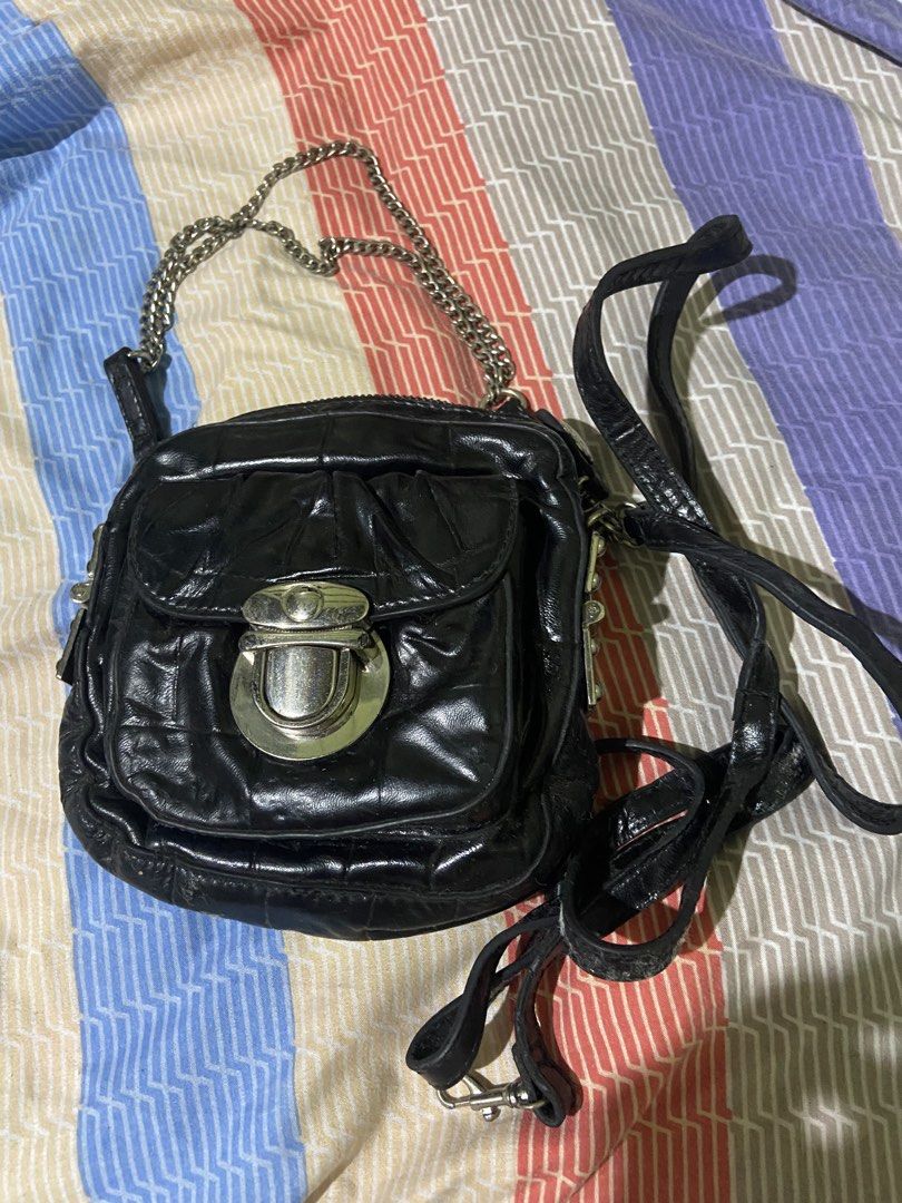 STACCATO Black Leather Quilted Chain Shoulder Bag (Category: Shoulder Bags) located in Tarlac. Submitted by pangz0918 (Listing ID 1459809044, Image 1). Description: - Brand: STACCATO - Material: Black Leather - Design: Quilted - Hardware: Silver turn-lock closure and chain strap - Straps: Silver chain strap and a longer leather strap - Compartments: Zippered main compartment with interior zippered pocket - Condition: Shows some signs of wear on l