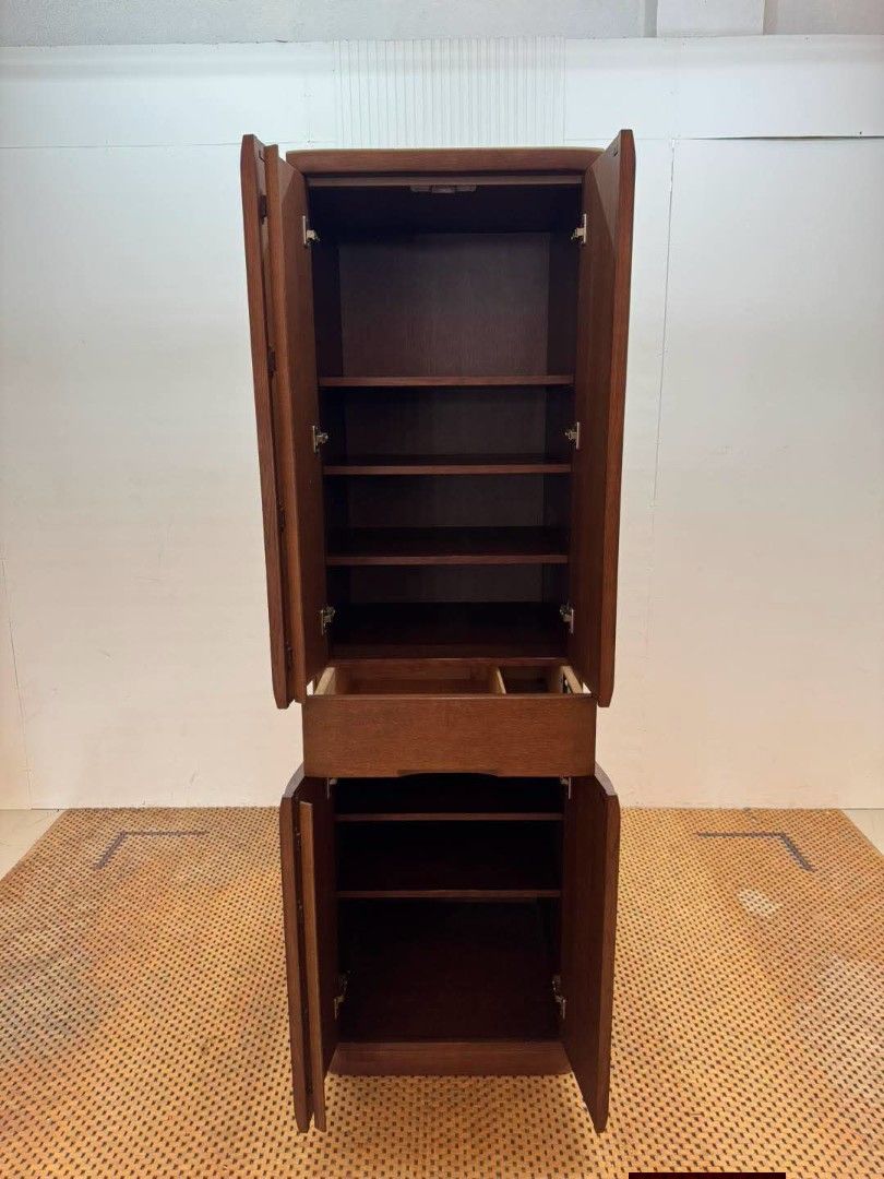 Storage Cabinet (Category: Shelves, Cabinets & Racks) located in Meycauayan. Submitted by marygracecasimiro (Listing ID 1459709880, Image 2). Description: Vintage Tall Wooden Storage Cabinet with Drawer Price: 12,500 L23.5 x W23 x H80 In good condition♥️ It has a slim vertical design, four-door storage, multiple adjustable shelves, and a center drawer, making it suitable for clothing, linens, dishes, books, or general household storage..