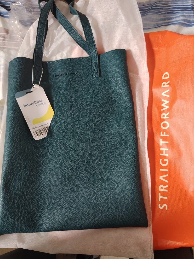 Straightforward tote bag (Category: Tote Bags) located in Mandaluyong City. Submitted by pinkcel (Listing ID 1459745201, Image 1). Description: Brand new with tag Teal color 33 x 42 x 2 Fit laptop and documents 2pcs available Sf shouldered by the buyer.