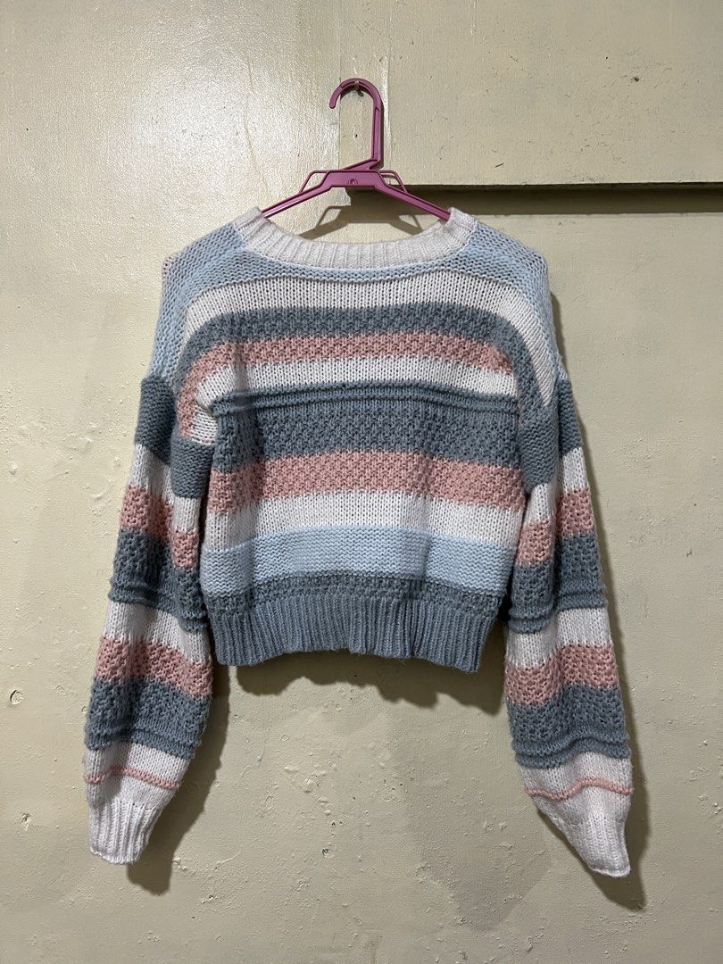 Striped Knit Cropped Sweater (Category: Longsleeves) located in Taguig. Submitted by kirsch333 (Listing ID 1459858560, Image 1). Description: - Cozy knit sweater - Colorful stripe pattern (blue, pink, white, grey) - Textured knit details - Cropped length - Ribbed cuffs and hem - Perfect for casual wear.