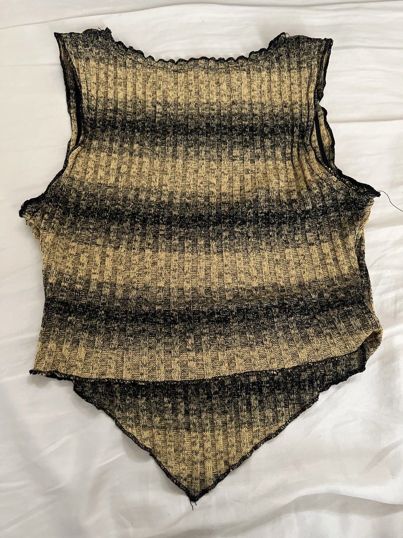 Striped Knit Halter Neck Tank Top (Category: Sleeveless) located in Pasig City. Submitted by crybaby666 (Listing ID 1459742829, Image 2). Description: - Cool striped knit tank top - Halter neck style - Handkerchief hem - Ribbed knit texture - Tan and black stripe pattern - Versatile: pairs well with jeans or shorts - Unique addition to your wardrobe.