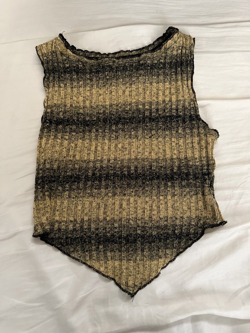 Striped Knit Halter Neck Tank Top (Category: Sleeveless) located in Pasig City. Submitted by crybaby666 (Listing ID 1459742829, Image 1). Description: - Cool striped knit tank top - Halter neck style - Handkerchief hem - Ribbed knit texture - Tan and black stripe pattern - Versatile: pairs well with jeans or shorts - Unique addition to your wardrobe.