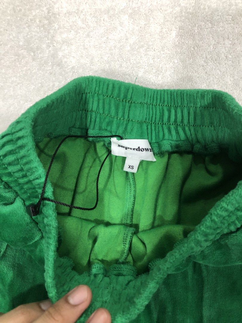 Superdown Green Velour Track Pants XS (Category: Other Bottoms) located in Manila. Submitted by janmichael26601 (Listing ID 1459795173, Image 3). Description: - Brand: Superdown - Color: Green - Material: Velour - Style: Track Pants - Features: Elastic waistband with drawstring, cuffed ankles - Comfort: Super soft and comfy - Occasion: Lounging or casual wear - Size: XS.