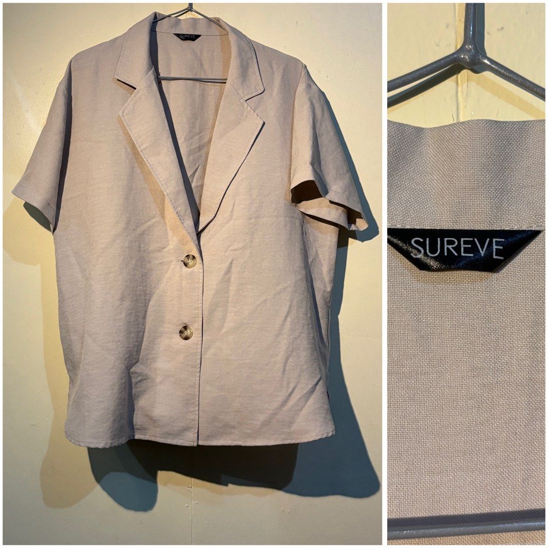 SUREVE Beige Short Sleeve Blazer (Category: Coats, Jackets and Outerwear) located in Manila. Submitted by deyn20 (Listing ID 1459770988, Image 1). Description: BEST FITS M-L - Beige short sleeve blazer by SUREVE - Features a two-button closure - Collared neckline with lapels - Ideal for layering or wearing as a standalone piece - A versatile wardrobe essential.