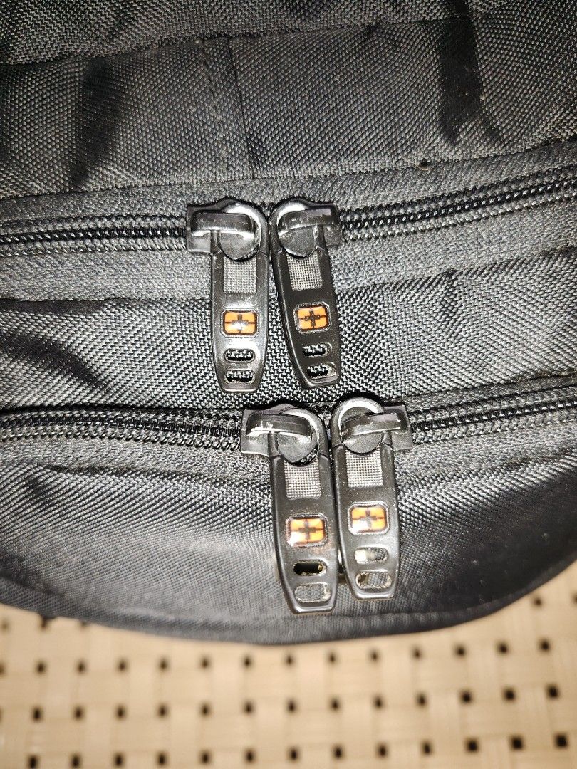 SWITZ CROSS Black Backpack (Category: Backpacks) located in Manila. Submitted by goldeneagle-41fe (Listing ID 1459842171, Image 3). Description: - Brand: SWITZ CROSS - size 18×12×8 - good condition 10/10 - color rate 10/0 - Color: Black - Features: Multiple zippered compartments for organization - Comfort: Padded straps - Durability: Made with durable material - Ideal for: School or travel - Security: Zippers have built-in locks.