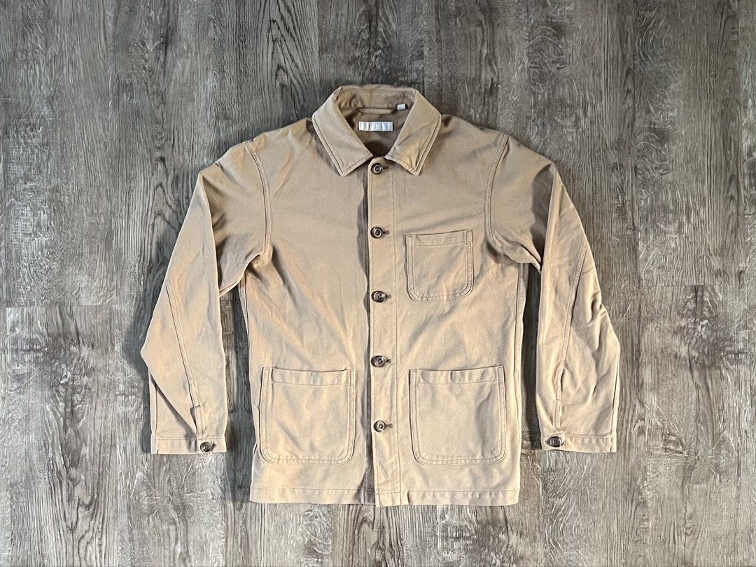 Uniqlo Tan Chore Jacket (Category: Coats, Jackets and Outerwear) located in Cebu City. Submitted by rap.declutter (Listing ID 1459788297, Image 1). Description: - Classic tan chore jacket - Button-up front - Four functional pockets - Long sleeves with button cuffs - Made from sturdy cotton twill - Ideal for layering or wearing solo - A versatile addition to any outfit.