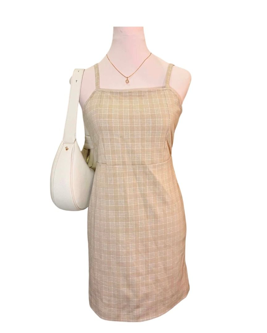 Tan Plaid Mini Dress with Spaghetti Straps (Category: Dresses) located in Baguio. Submitted by ellamell (Listing ID 1459747953, Image 1). Description: 44cm bust 41cm waist 72cm length/height - Cute tan plaid mini dress - Spaghetti strap design - Lightweight and comfortable fabric - Perfect for casual outings or summer events - Versatile styling with sandals or sneakers - A great wardrobe addition.