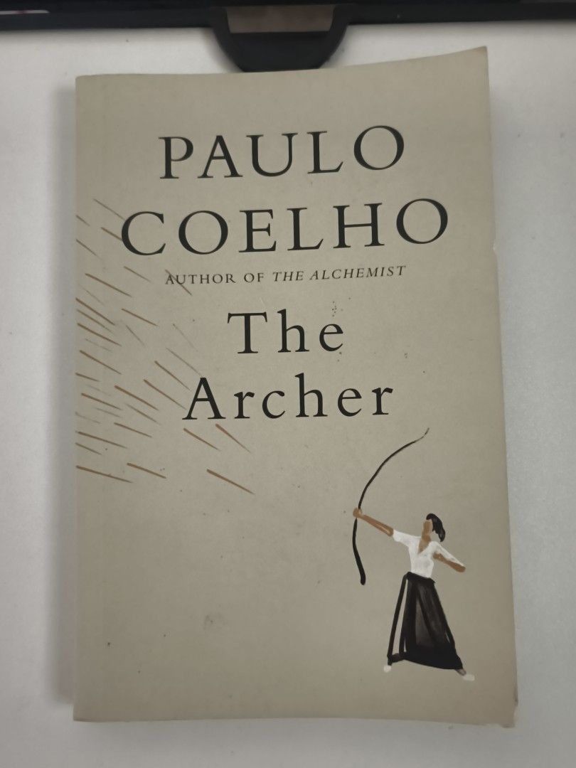 The Archer - Paulo Coelho (Category: Storybooks) located in Dasmarinas. Submitted by alleethrifthauls (Listing ID 1459737078, Image 1). Description: Hey mga ka-bookworm! ✨ This book is a beautiful story about a young man's journey to understand the bow and arrow, guided by wisdom from an elder. Perfect for anyone looking for inspiration and a reminder to live life to the fullest, embracing risks and unexpected turns. This is an international edit