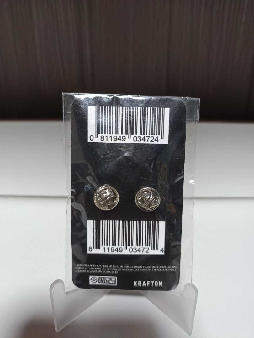 The Callisto Protocol Corrections Enamel Pin (Category: Western Merchandise) located in Baguio. Submitted by cracklin.aniue26 (Listing ID 1459813067, Image 2). Description: - Official The Callisto Protocol enamel pin - Features the iconic Corrections logo - Brand new, sealed in original packaging - Authentic Krafton branding visible on the back - Ideal for game fans and collectors Location: Baguio City Pm for more details and inquiries .