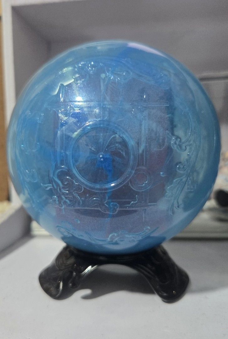 "The Frame" SKULLPANDA The Mirage Series (Category: Designer & Blind Box Toys) located in Manila. Submitted by fierceriver.e57033 (Listing ID 1459793551, Image 3). Description: - Adorable collectible figure - Encased in a blue crystal ball - Figure has big eyes and unique hairstyle - Sitting pose with red cloth accent - Crystal ball features intricate external designs - Includes a sturdy black stand - Ideal display piece for collectors.