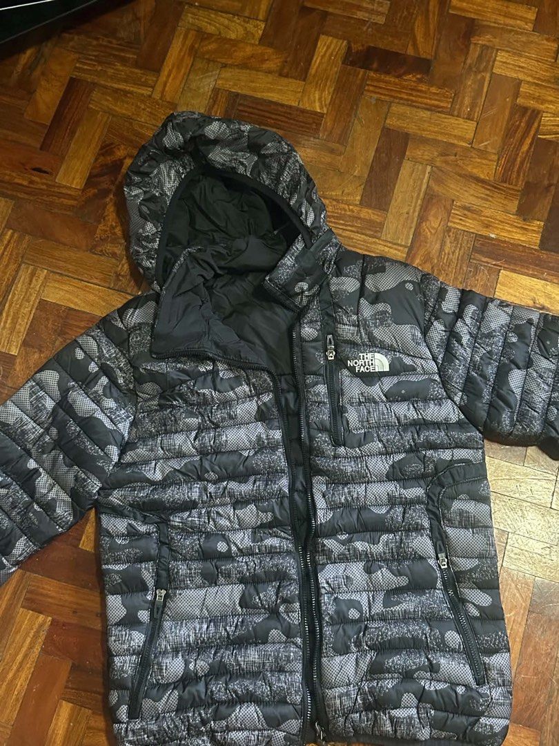 The North Face Camo Puffer Jacket (Category: Coats, Jackets and Outerwear) located in Makati City. Submitted by kriscelity (Listing ID 1459800151, Image 1). Description: THE NORTH FACE Camo Puffer Jacket | Excellent Condition | ₱2200 The North Face puffer jacket 🖤 Black/gray camo print ✨ Excellent condition Worn only a few times No stains, tears, or major flaws Hooded | Full zip | Multiple zip pockets ₱2000 negotiable Selling because rarely used