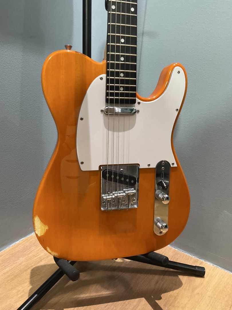Thompson Telecaster Butterscotch ELECTRIC GUITAR with strings (Category: Musical Instruments) located in Manila. Submitted by zftkkyj5vn02573 (Listing ID 1459740040, Image 1). Description: PERSONAL OWNED colorway: butterscotch orange / white🔥 freebies: with thompson accesories 2 extra strings capo issues: shown at picture bottom left part of the guitar 📍ANTIPOLO via LALAMOVE.