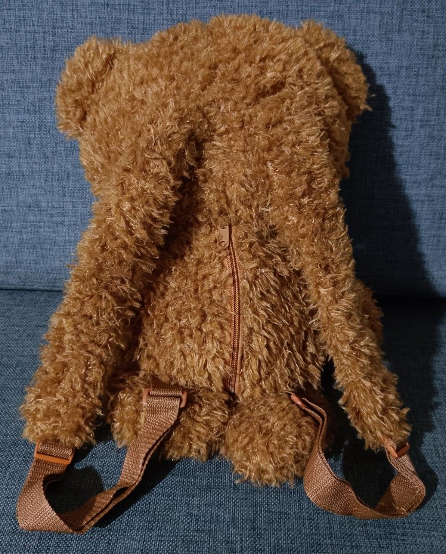 Tim Bear from Despicable Me Plush Bag (Category: Backpacks) located in San Pedro. Submitted by max__collectibles (Listing ID 1459798064, Image 3). Description: - Approximately 18 inches tall - Adjustable shoulder straps (longest length: 31 inches) - Zippered main compartment for storage - Ideal for carrying essentials or as a fun fashion statement.