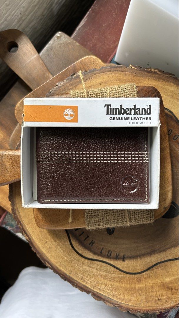 Timberland Genuine Leather Bifold Wallet (Category: Wallets & Card Holders) located in Quezon City. Submitted by mattieubahia (Listing ID 1459742466, Image 1). Description: - Genuine leather Timberland bifold wallet - Rich dark brown color - Multiple card slots for your essentials - Clear ID window for easy access - Includes original Timberland box - Ideal for everyday carry and use - Shipping fee will be handled by the buyer.