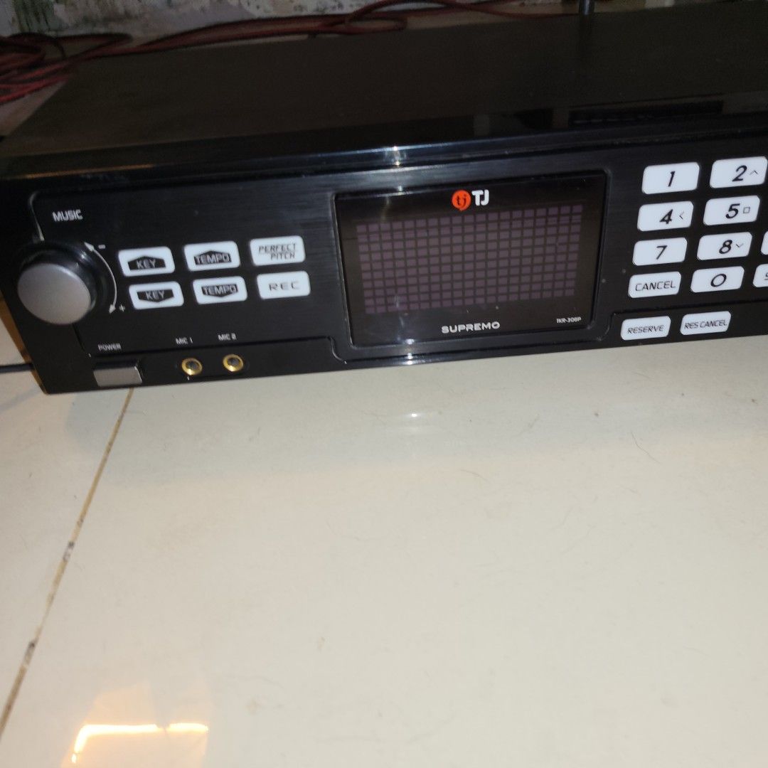 TJ Supremo TKR-300P Karaoke Player (Category: Portable Music Players) located in San Jose del Monte. Submitted by grace36th (Listing ID 1459704486, Image 1). Description: - TJ Supremo TKR-300P Karaoke Player - Music controls: Key and Tempo adjustment - Special features: Perfect Pitch and Record function - Connectivity: Two microphone inputs - Display: Shows song information - User-friendly buttons: Number selection, Cancel, Reserve, Res-Cancel.