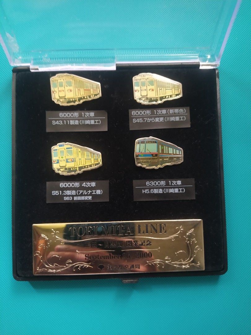 TOEI Railway Mita Line Train Pins Set (Category: Vintage Collectibles) located in Agdangan. Submitted by enzodeklutz (Listing ID 1459730790, Image 1). Description: - Set of 5 Toei Railway Mita Line train pins - Includes various train models and years - Comes in a presentation case - Commemorative item from September 26, 2000 - Ideal for collectors and train enthusiasts.