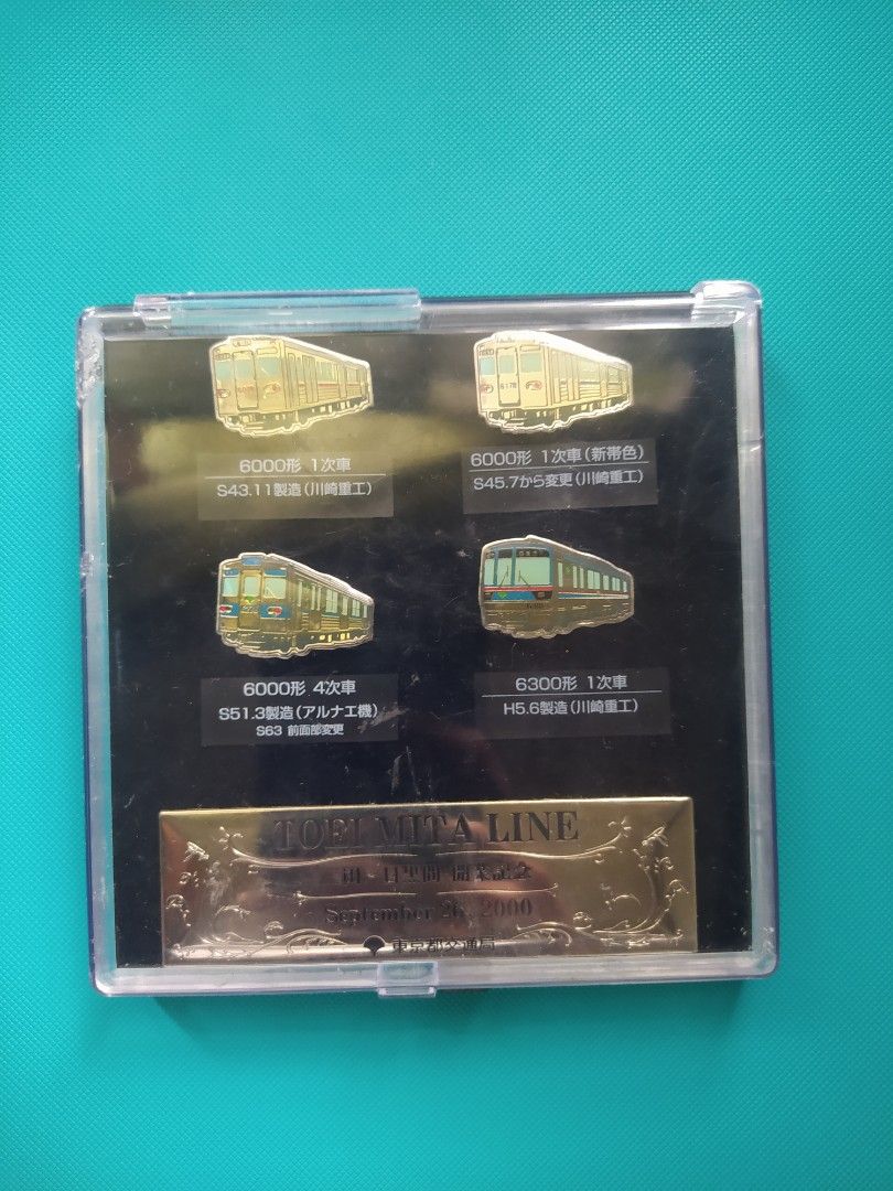 TOEI Railway Mita Line Train Pins Set (Category: Vintage Collectibles) located in Agdangan. Submitted by enzodeklutz (Listing ID 1459730790, Image 2). Description: - Set of 5 Toei Railway Mita Line train pins - Includes various train models and years - Comes in a presentation case - Commemorative item from September 26, 2000 - Ideal for collectors and train enthusiasts.