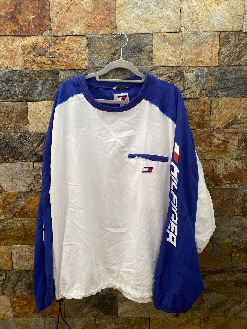 Tommy Hilfiger Athletics Windbreaker (Category: Coats, Jackets and Outerwear) located in Manila. Submitted by asiongmx (Listing ID 1459724308, Image 1). Description: - Tommy Hilfiger Windbreaker Jacket - Color: Blue and White - Size: XL - Features Tommy Hilfiger logo on chest pocket and sleeve - Ideal for casual wear or sports activities * Decluttering.