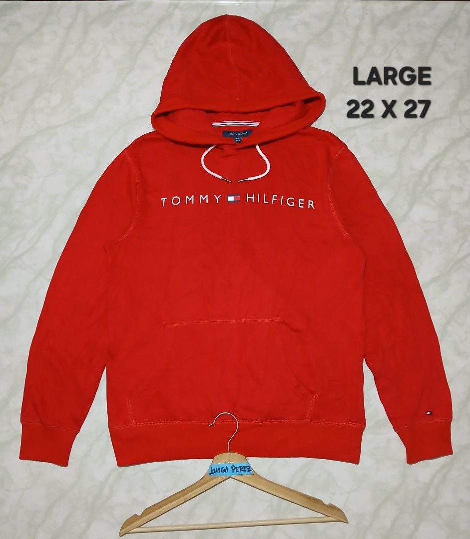 Tommy Hilfiger Red Hoodie - Large (Category: Hoodies) located in Plaridel. Submitted by igieperez147282 (Listing ID 1459811186, Image 1). Description: - Classic red Tommy Hilfiger hoodie - Iconic logo across the chest - Drawstring hood - Front pocket - Ribbed cuffs and hem - Perfect for casual wear - Measurements: 22 inches wide x 27 inches long.