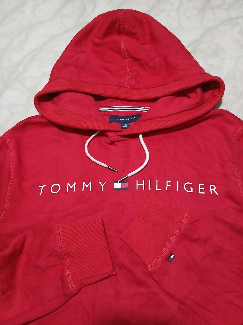 Tommy Hilfiger Red Hoodie - Large (Category: Hoodies) located in Plaridel. Submitted by igieperez147282 (Listing ID 1459811186, Image 2). Description: - Classic red Tommy Hilfiger hoodie - Iconic logo across the chest - Drawstring hood - Front pocket - Ribbed cuffs and hem - Perfect for casual wear - Measurements: 22 inches wide x 27 inches long.