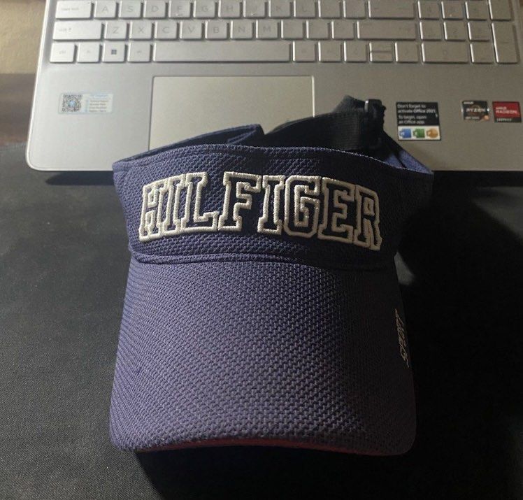 Tommy Hilfiger Sport Visor Cap (Category: Caps & Hats) located in Manila. Submitted by bd10eclutters (Listing ID 1459884360, Image 1). Description: - Navy blue Tommy Hilfiger visor - White 'Hilfiger' embroidery on the front - 'Sport' embroidered on the side - Adjustable strap at the back - Ideal for sunny weather.