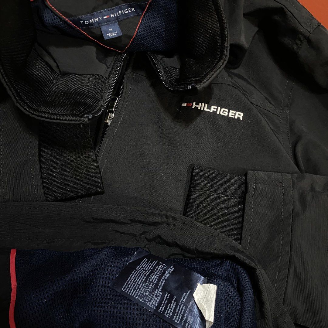 TOMMY HILFIGER YATCH JACKET WITH PACKABLE HOOD (Category: Coats, Jackets and Outerwear) located in Pasig City. Submitted by buzzthrifty (Listing ID 1459835136, Image 3). Description: SIZE S-M MEN M-L WOMEN 20x25 EXCELLENT CONDITION issue lang yung print sa batok faded na .