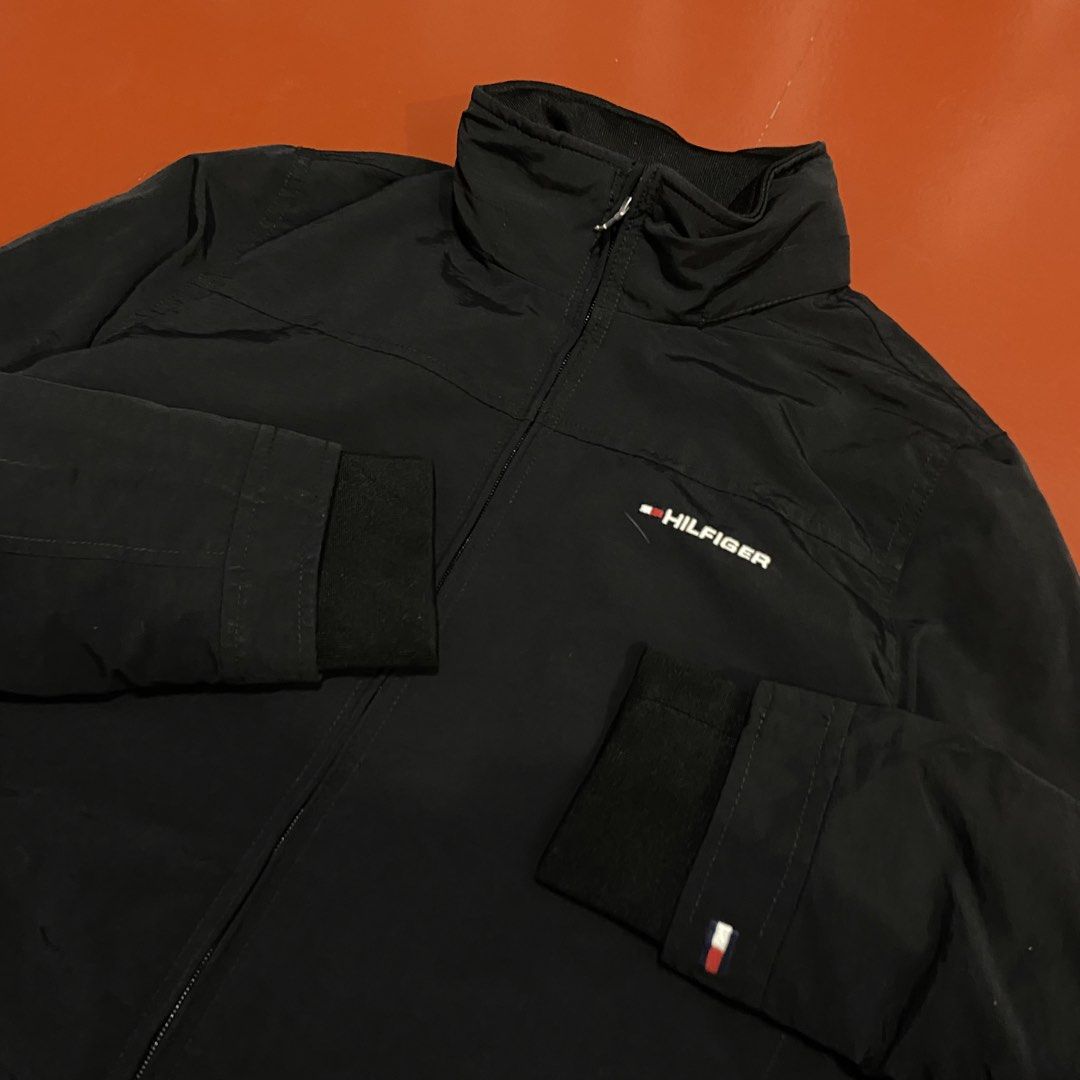 TOMMY HILFIGER YATCH JACKET WITH PACKABLE HOOD (Category: Coats, Jackets and Outerwear) located in Pasig City. Submitted by buzzthrifty (Listing ID 1459835136, Image 2). Description: SIZE S-M MEN M-L WOMEN 20x25 EXCELLENT CONDITION issue lang yung print sa batok faded na .