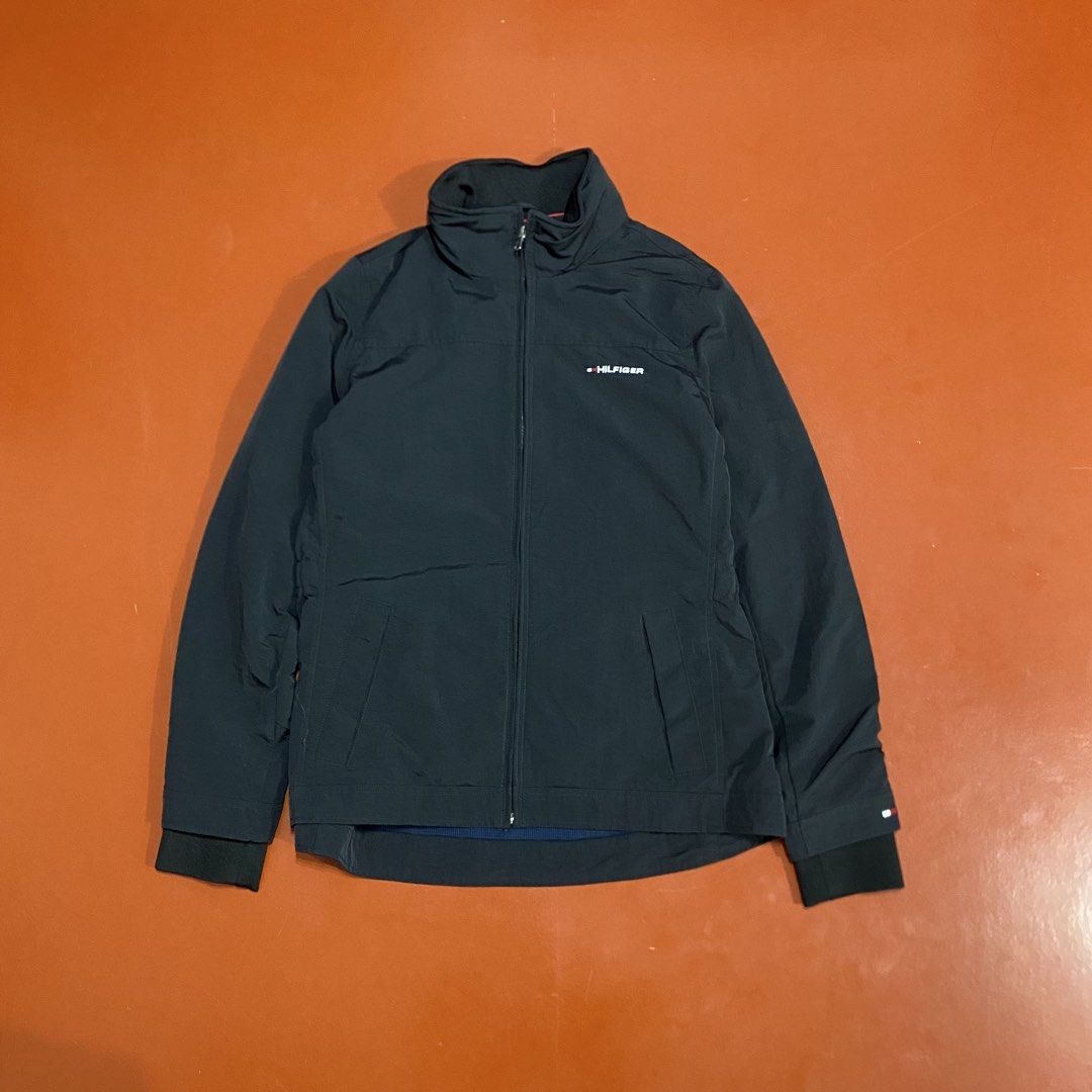 TOMMY HILFIGER YATCH JACKET WITH PACKABLE HOOD (Category: Coats, Jackets and Outerwear) located in Pasig City. Submitted by buzzthrifty (Listing ID 1459835136, Image 1). Description: SIZE S-M MEN M-L WOMEN 20x25 EXCELLENT CONDITION issue lang yung print sa batok faded na .
