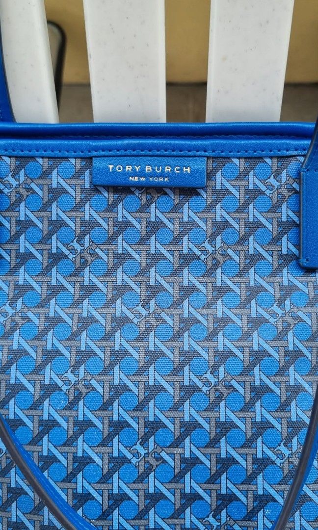 Tory Burch Blue Monogram Tote Bag (Category: Luxury Bags & Wallets) located in Taguig. Submitted by nanzmango (Listing ID 1452106746, Image 2). Description: - Blue Tory Burch tote bag - Signature monogram pattern - Leather trim and handles - Zipper closure at the top - Spacious interior - Ideal for everyday use , very pretty in actual - signs of usage . please see last 2 pics . additional fotos can be requested for sure buyer . Thank you.