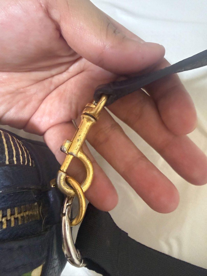 Tory Burch Striped Bag (Category: Cross-body Bags) located in Caloocan City. Submitted by angelala17 (Listing ID 1459726853, Image 3). Description: • Original Tory Burch design • Multicolor striped pattern • Spacious interior • Gold-tone hardware • Pre-loved, good condition.
