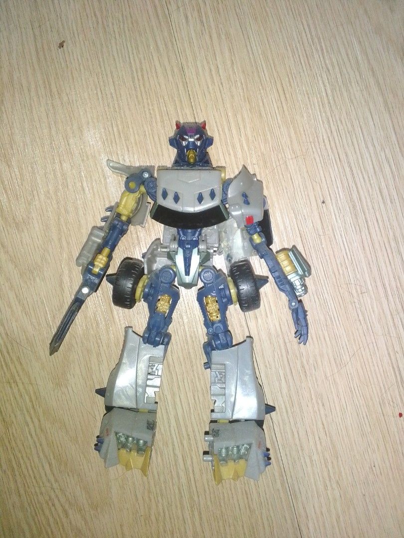 Transformers Hunt for the Decepticons Deluxe class: Axor (Category: Action & Battle Toys) located in Manila. Submitted by zenfish.8a8bb6 (Listing ID 1459829215, Image 1). Description: Selling Transformers Hunt for the Decepticons Deluxe class: Axor - Transforms between car and robot modes - Robot mode: Blue, gray, and yellow color scheme - good articulated and good condition - accessories: engine (original) - no damaged and issue what you see is 