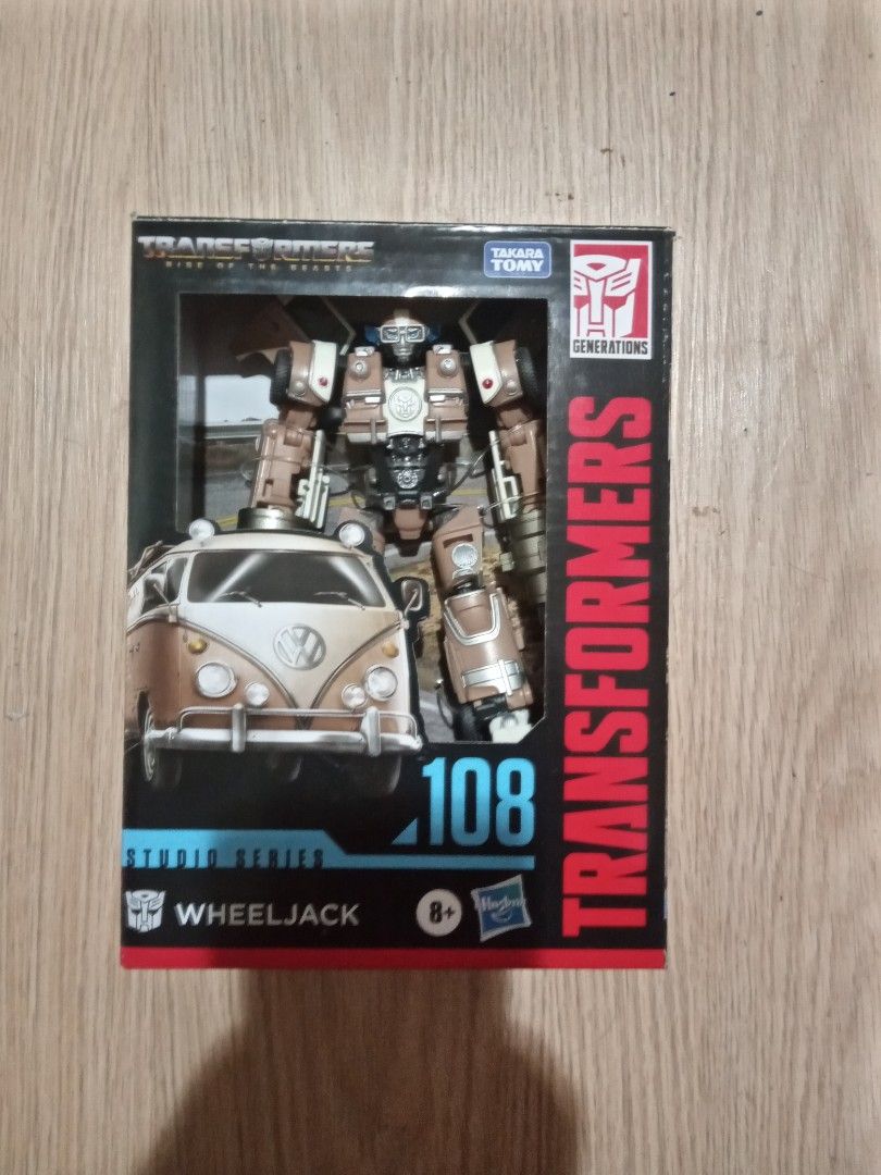 Transformers Studio Series 108 ROTB Wheeljack with upgrade kit. (Category: Vehicle & Diecast Models) located in Manila. Submitted by zenfish.8a8bb6 (Listing ID 1459828500, Image 1). Description: Selling Transformers Studio Series 108 Wheeljack action figure with upgrade kit Description - Transforms into a Volkswagen van. - Includes original packaging. - Van has "TV Pablo" printed detail. - accessories: G1 laser blaster (original), two cannons (up