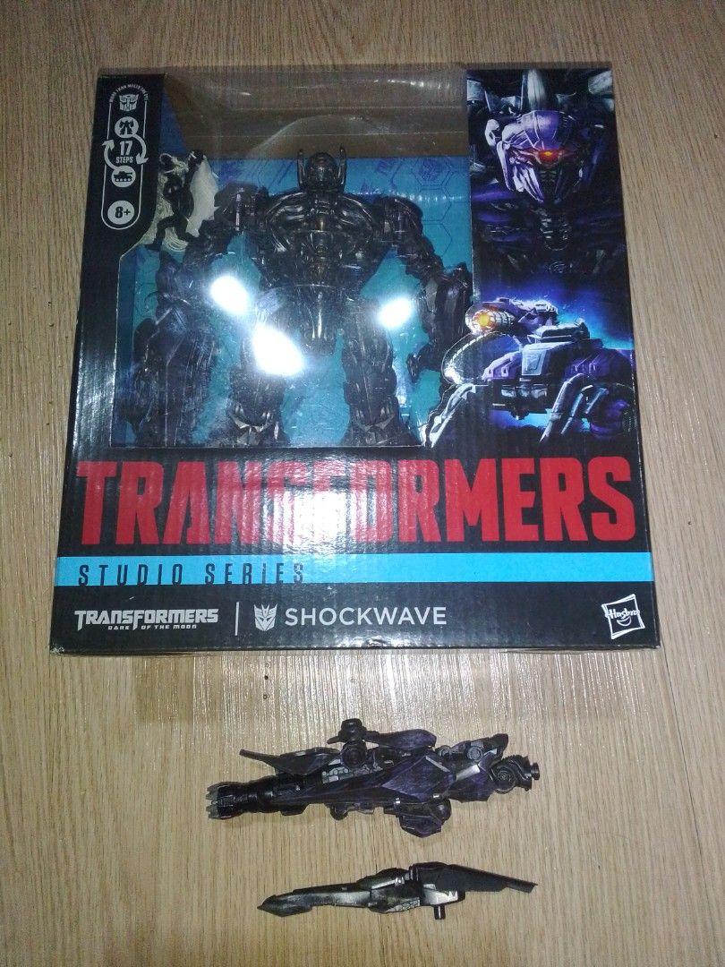 Transformers Studio Series 56 Leader Class DOTM Shockwave with upgrade kit (Category: Action & Battle Toys) located in Manila. Submitted by zenfish.8a8bb6 (Listing ID 1459836469, Image 3). Description: Selling Transformers Studio Series 56 Leader Class Shockwave Description - original made from Hasbro - Transforms into a cybertronian tank - Includes original packaging. - accessories: hose, rubber blade, with mini figurine: paratrooper, Brains, Wh