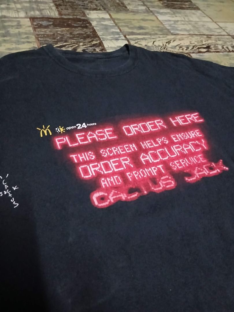 Travis Scott McDonald's Cactus Jack Rap Tee Shirt (Category: Tshirts & Polo Shirts ) located in Manila. Submitted by sendecluttersandsells (Listing ID 1459802200, Image 2). Description: Travis Scott Cactus Jack Mcdonald's Rap Tee Shirt Size: L Dimes: 23x29 Issue: Needs washing, crack prints and vintage vibes fade Loc: Caloocan Ship: J&T Meetup: Monumento, SM Grand, Cloverleaf Mall (SM North, Trinoma Friday or Sunday) .