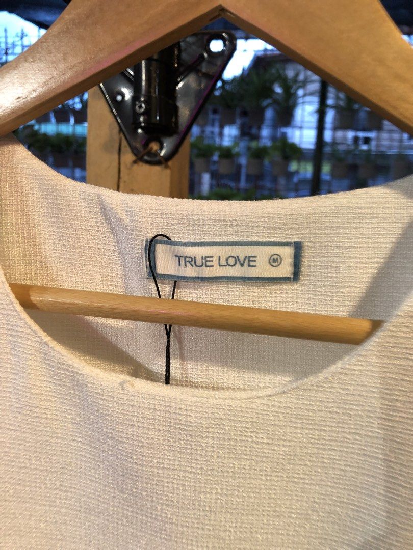True Love White Fringed Tank Top (Category: Sleeveless) located in Cauayan City . Submitted by wholly.craaaft (Listing ID 1459798593, Image 2). Description: - Brand: True Love - Type: Sleeveless Tank Top - Color: White - Fabric: Textured weave - Detail: Raw fringe hem - Condition: Small faint mark on front (visible in last photo) - Occasion: Casual wear.