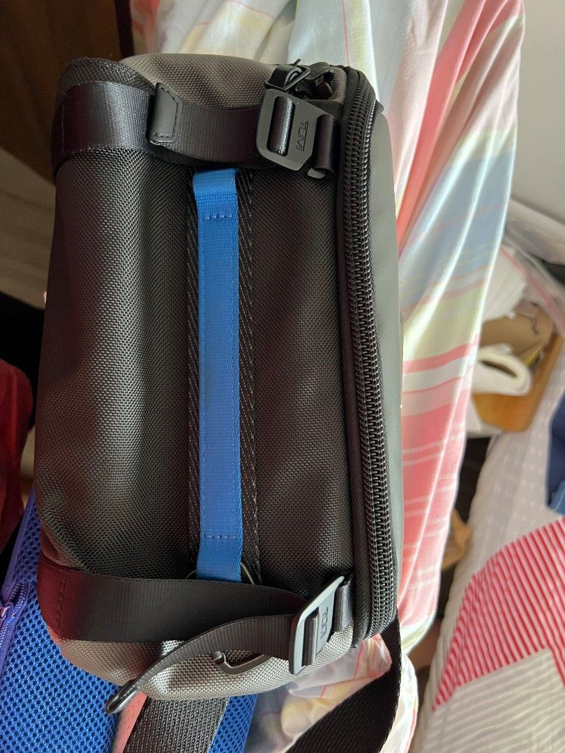 Tumi Alpha Bravo Platoon Sling (Category: Luxury Bags & Wallets) located in Manila. Submitted by kaiserx24 (Listing ID 1459864246, Image 1). Description: - Authentic Tumi bag - Stylish blue accent - Personalized JSCL tag included with extra tags - Bright blue interior with zippered pockets - Ideal for travel or everyday use - Smooth and functional zippers Exterior Zip entry to main compartment Back padded zip compartment Front daisy chains compat