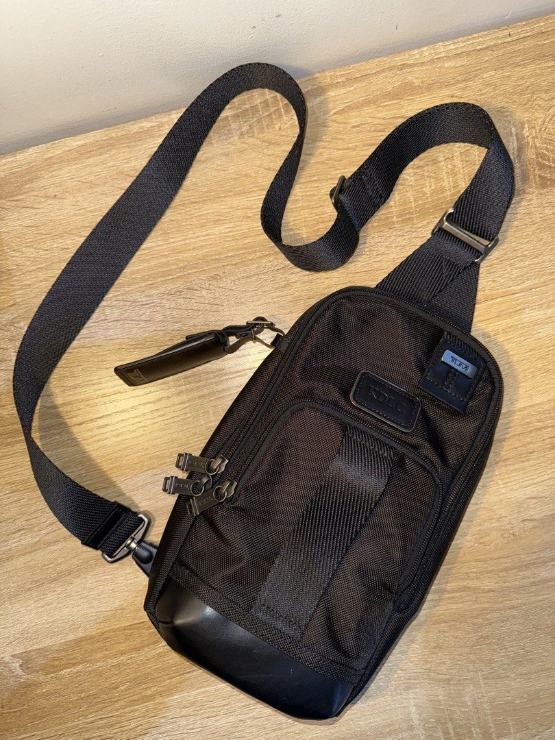 Tumi Fife Slim Sling Bag (Category: Sling Bags) located in Paranaque City. Submitted by Daniel. (Listing ID 1459781800, Image 1). Description: - Authentic Black Tumi Sling Bag - Made with durable nylon and premium leather accents - Features multiple zippered compartments for excellent organization - Adjustable strap for a comfortable, customized fit - Perfect for daily commutes or your next travel adventure.