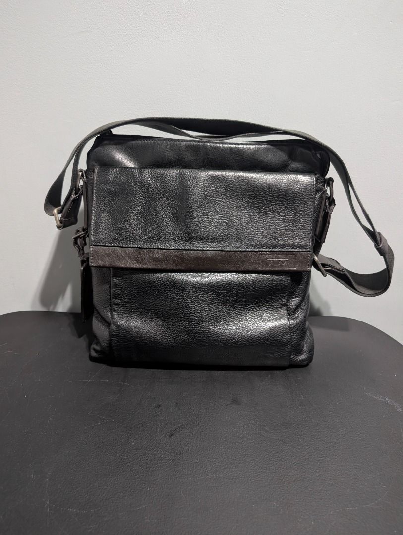 TUMI Leather Crossbody Bag (Category: Luxury Bags & Wallets) located in Manila. Submitted by shopby_g (Listing ID 1459879831, Image 1). Description: *Personal Item. Not Thrifted. Bought in the U.S *Used. Signs of use, common on leather goods. No Issues *Dimensions: 31.5cm x 29cm x 5.5cm *Shoulder strap: 60cm adjustable RFS: Declutter/Migrating.