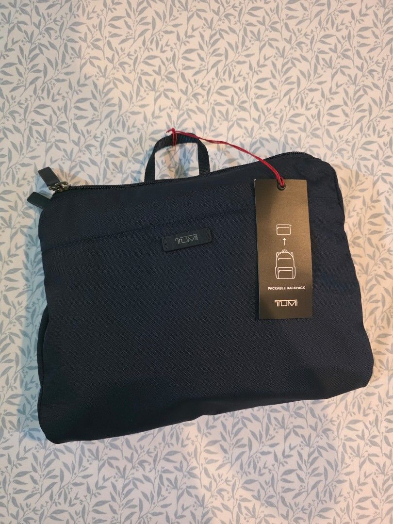 TUMI Packable Backpack Navy Blue (Category: Luxury Bags & Wallets) located in Las Pinas. Submitted by ekrmn (Listing ID 1459773487, Image 2). Description: Brand New Navy Blue TUMI Packable Backpack - Original tags still attached - Multiple zippered pockets on the front - Folds up compactly for easy storage and travel - Perfect for travel or everyday use.